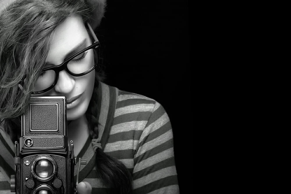 girl photographer camera black and white hair stripes glasses TLR viewfinder world photo day