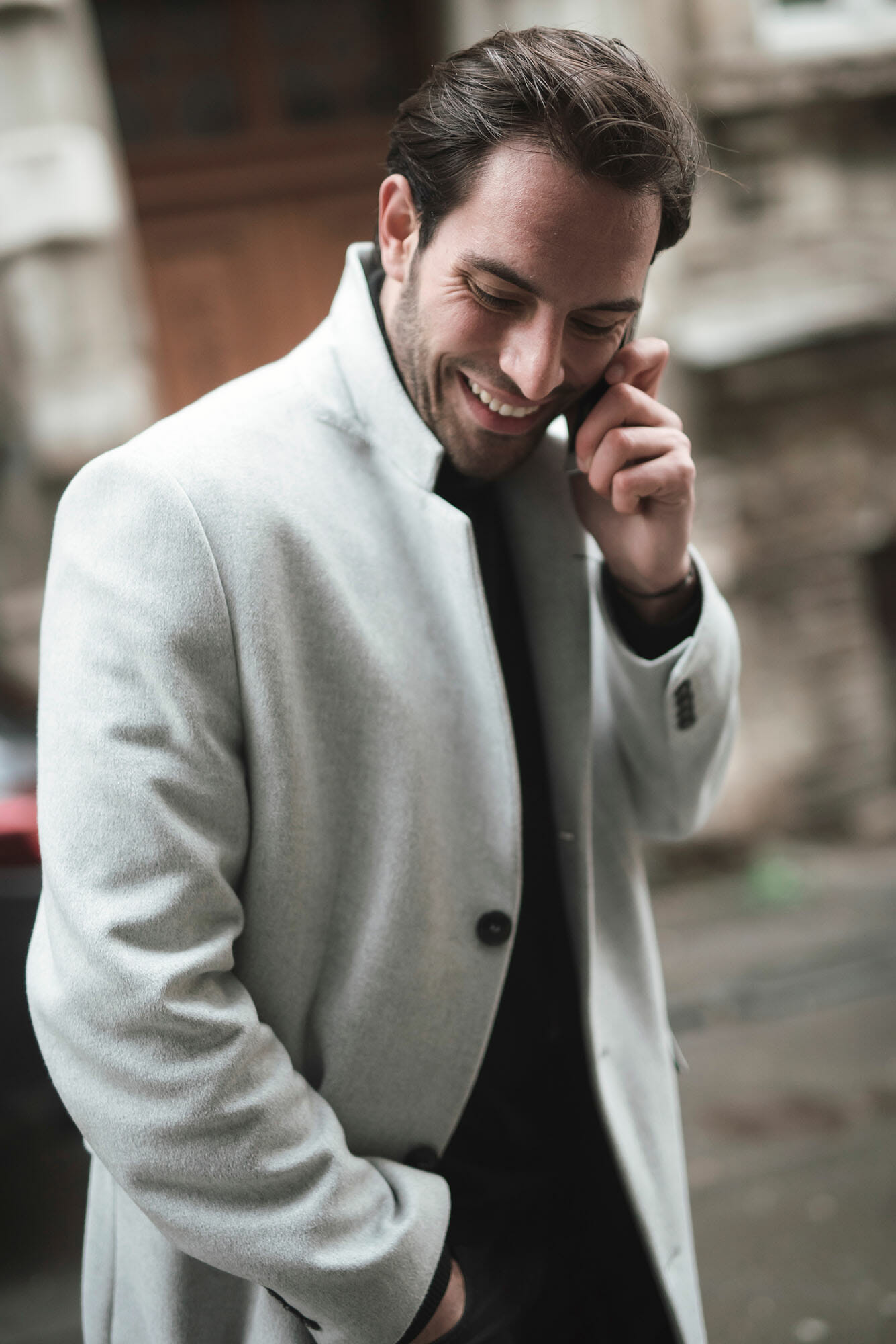 man talking on phone white coat street photography portrait city people camera subject light how to tutorial guide