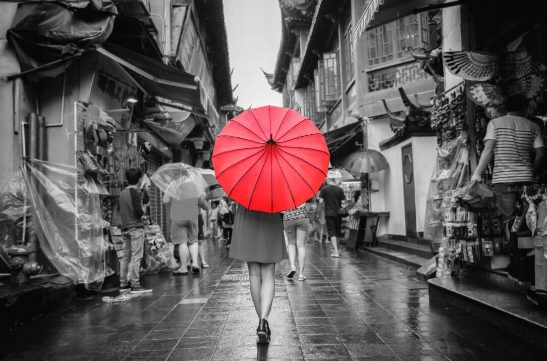 lady red umbrella market walking colour splash